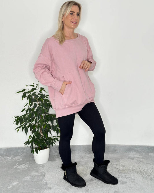 Rosa Oversized Langarm-Sweatshirt, Rundhals, mit schulterfreien Oberteilen und Kängurutaschen aus Baumwolle, innen gefüttert, Oberteil ist lang und mit gerippten Bündchen, Ärmelenden 